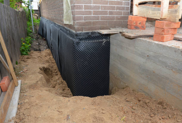 Happy homeowners after waterproofing job in Buffalo